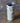 White tumbler with colorful animals of evolution illustrations on a textured surface
